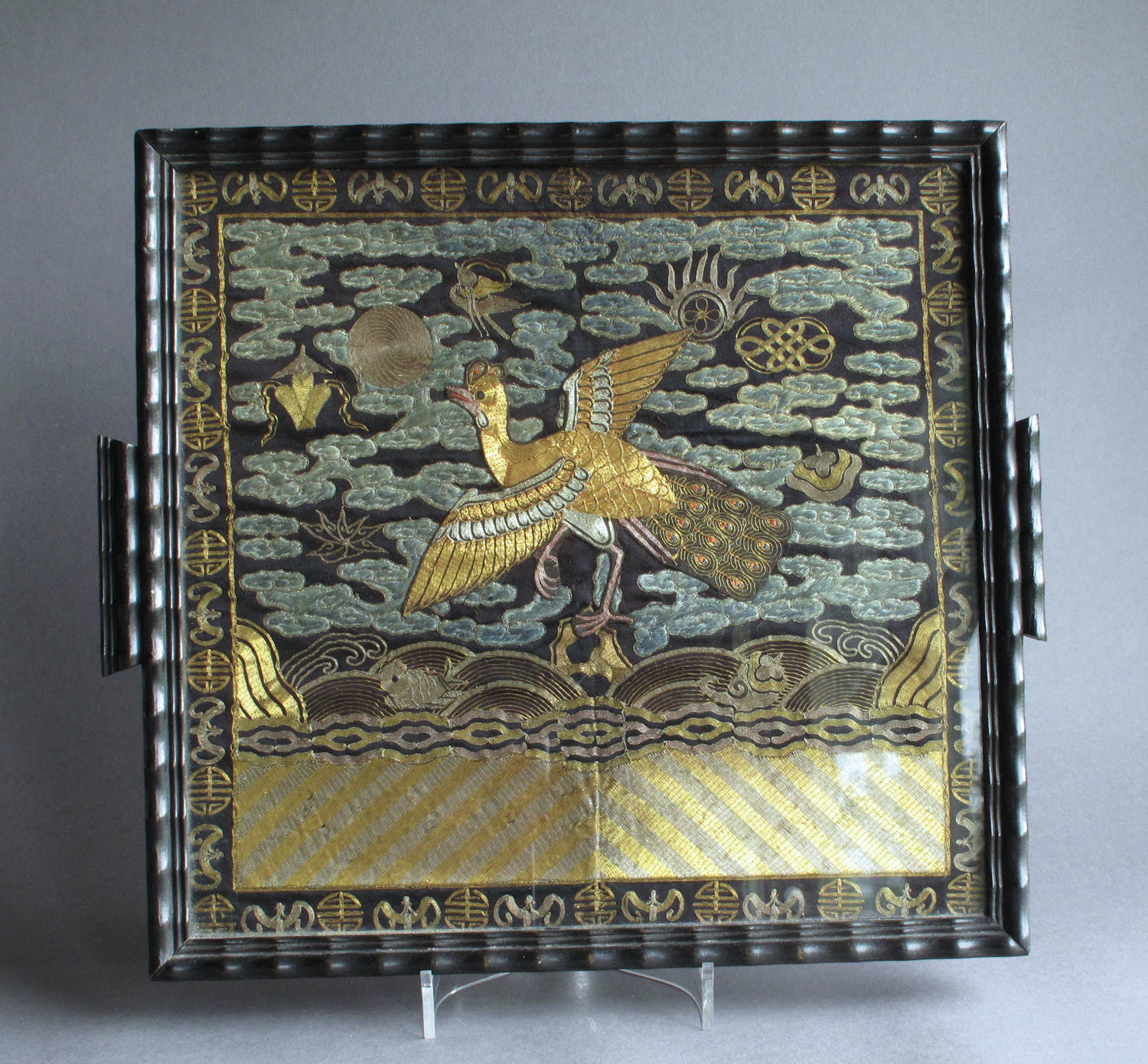 A Chinese late C19th silk rank badge, glazed and mounted as a tray