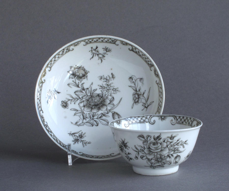 A Chinese export grisaille decorated teabowl and saucer, Qianlong