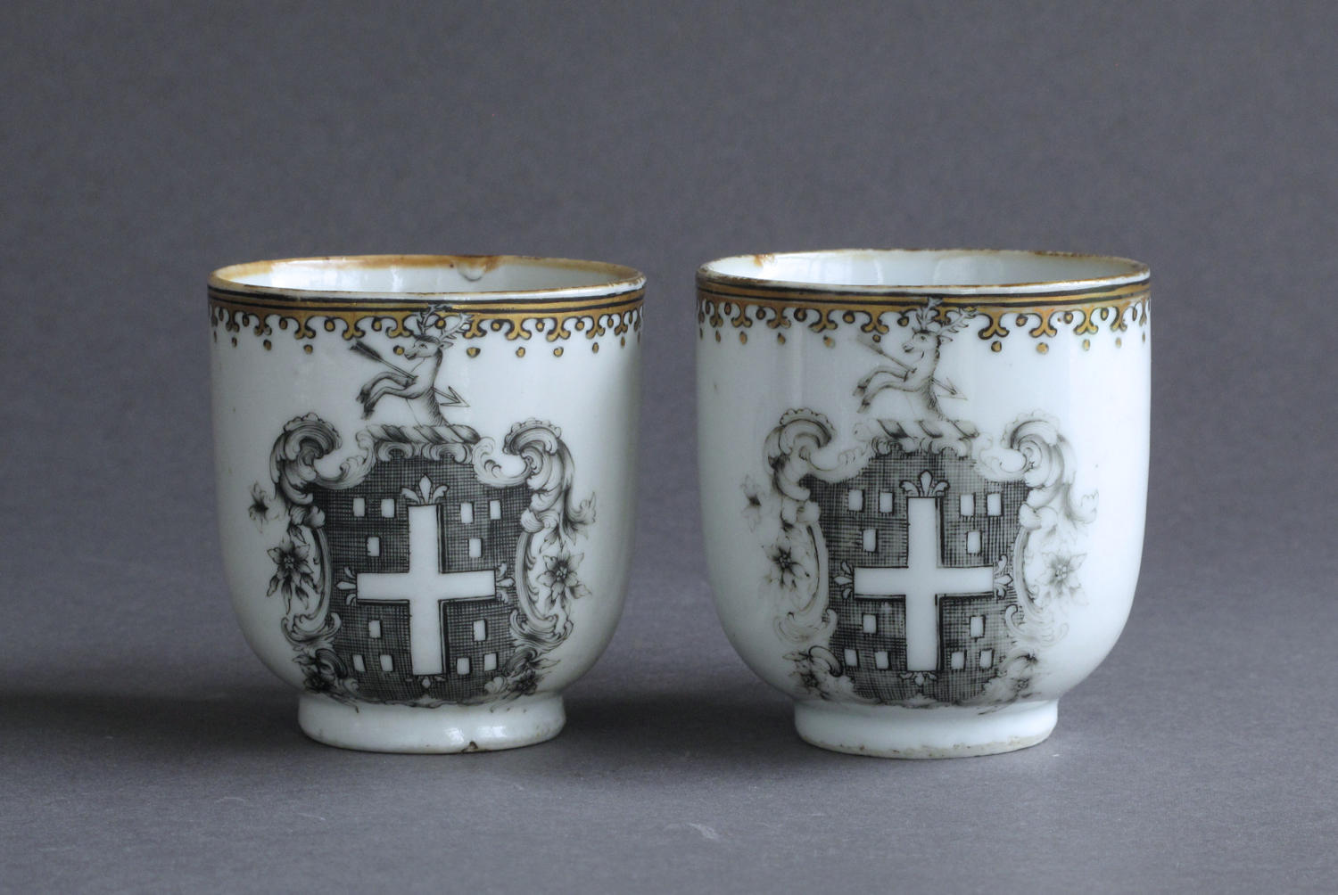 A pair of Chinese armorial grisaille coffee cups, Qianlong