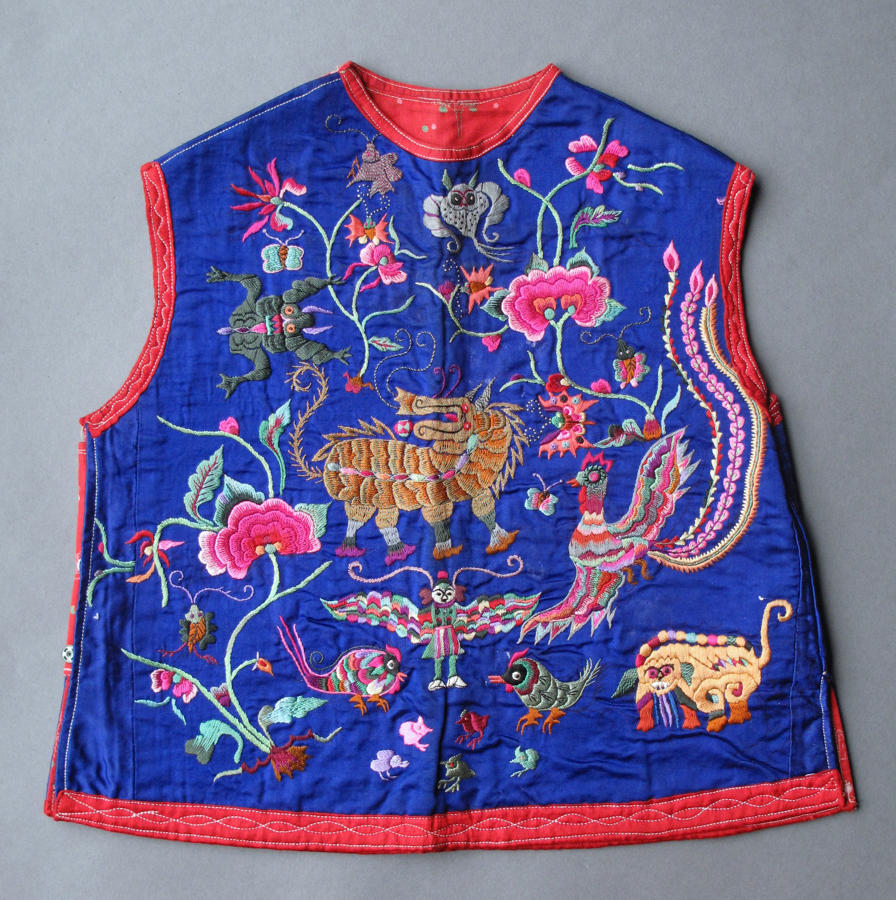 A charming Chinese silk sleeveless jacket for a child, early C20th