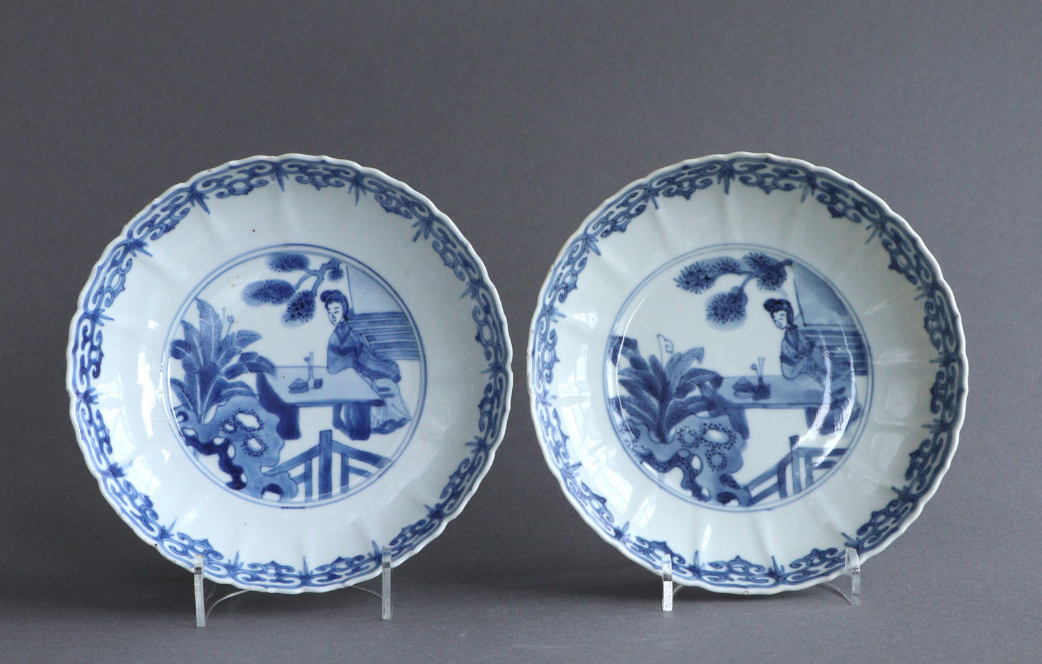 A pair of moulded Chinese saucer dishes, Kangxi