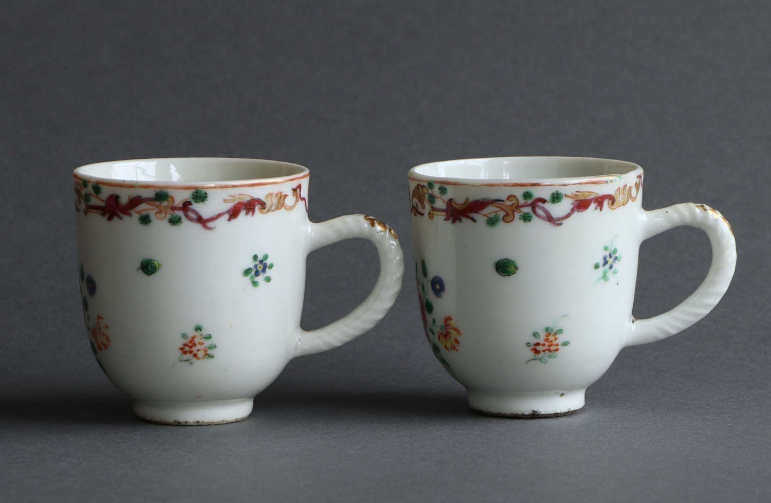 A pair of Chinese famille rose coffee cups with masonic design c1760