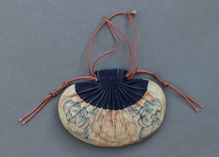 A late C19th/early C20th Chinese purse in cream and dark blue