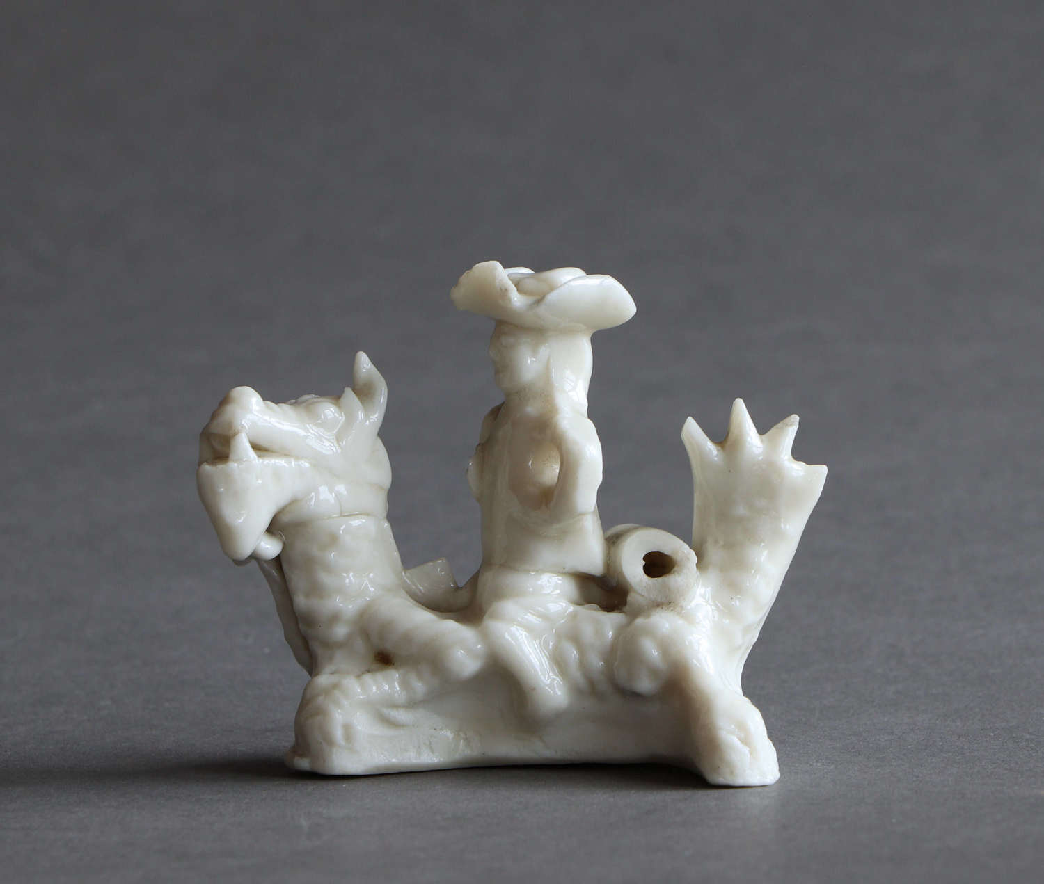Miniature blanc de Chine whistle with European man on a dragon Kangxi