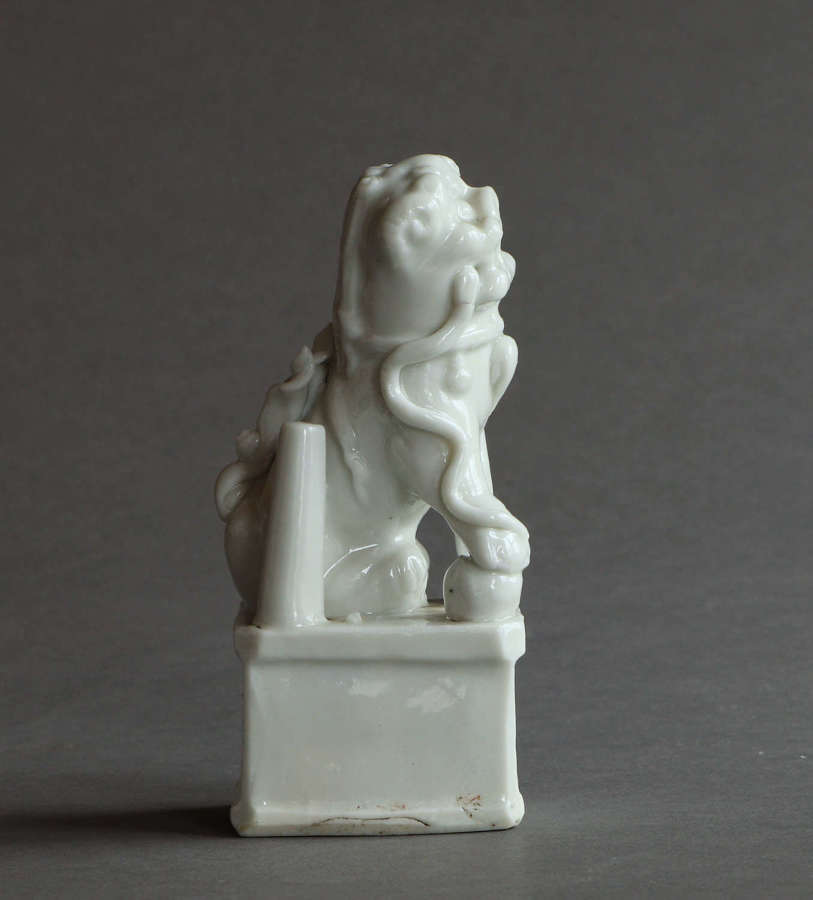 A Chinese blanc de Chine incense holder modelled as a Buddhist lion